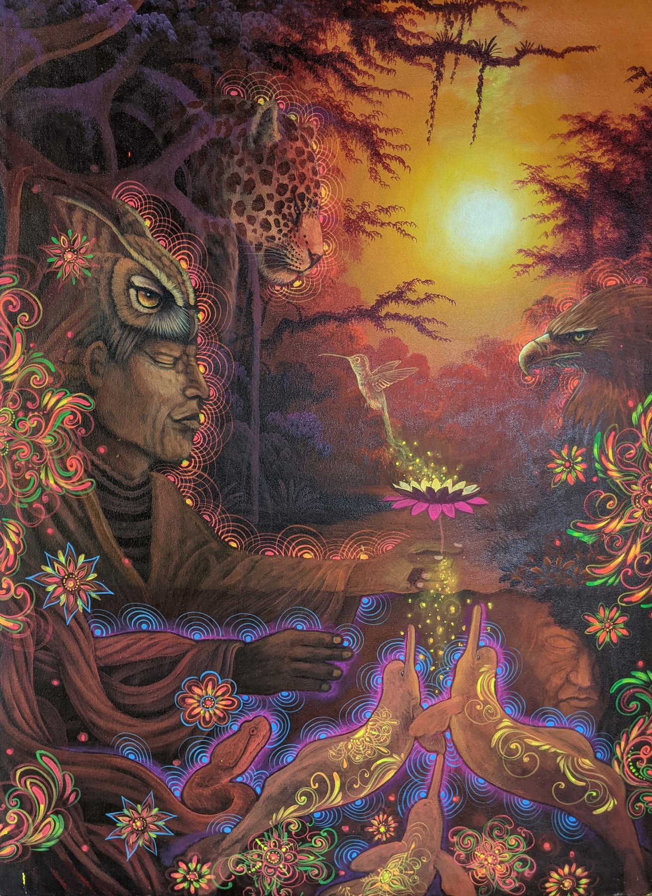 Visionary painting of an elder in an owl headdress offering a glowing flower to a hummingbird at sunset, with a jaguar and eagle nearby